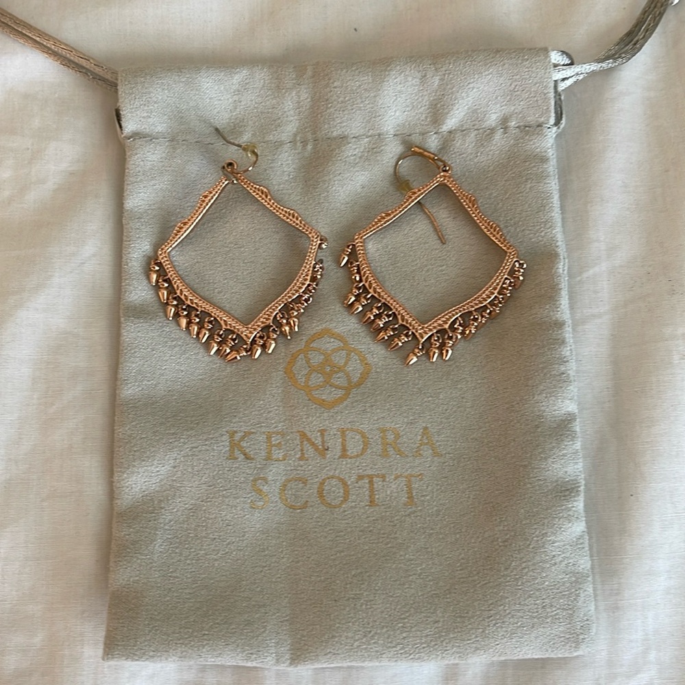 Kendra Scott rose gold chandelier earrings.